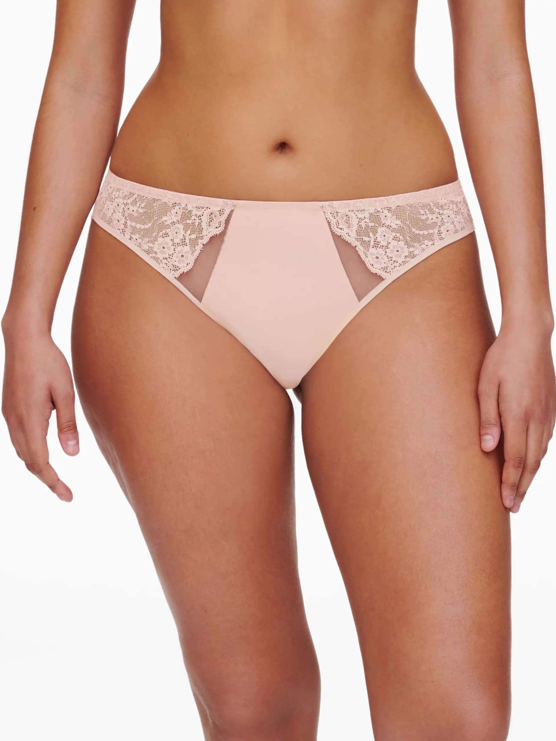 A woman wearing a lace-trimmed underwear, showcasing the front design.