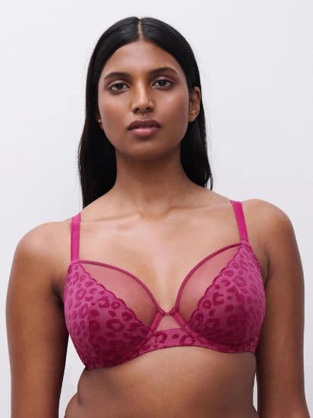 Model wearing a magenta leopard-print sheer bra, long straight black hair, neutral expression, plain white background.