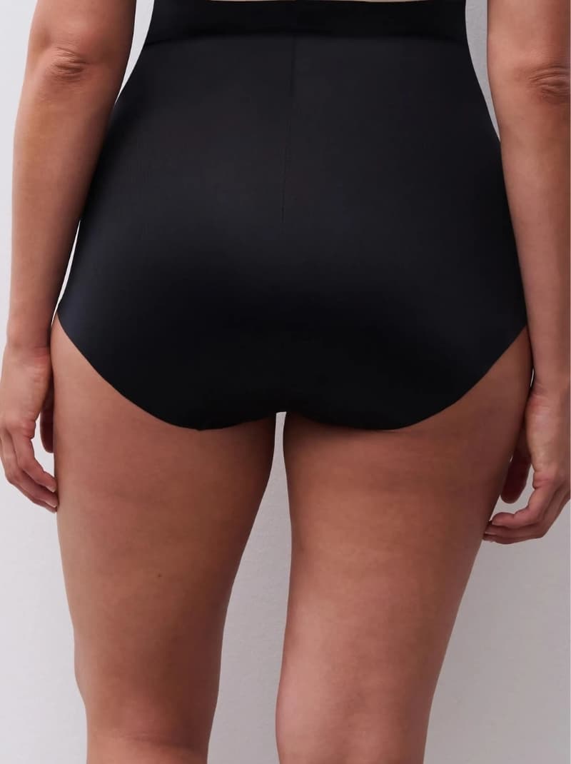Rear view of a person wearing a high-waisted black undewear.