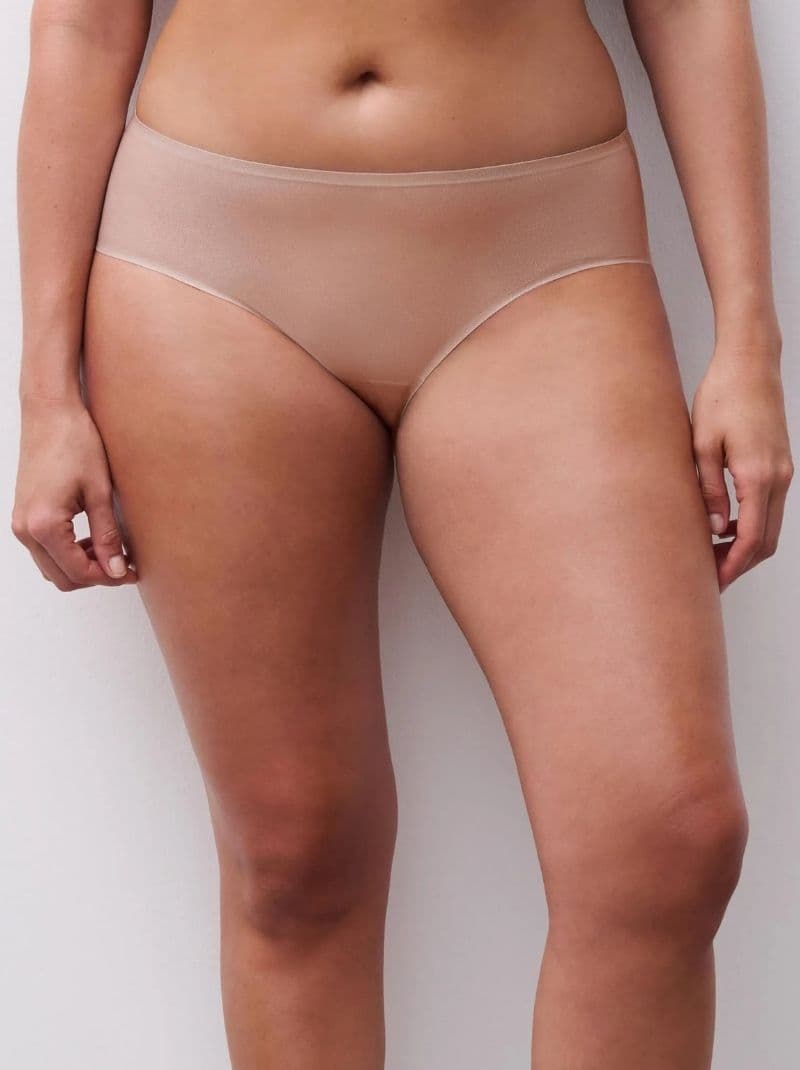 Person wearing a golden glow high-waisted seamless underwear, standing against a white background.