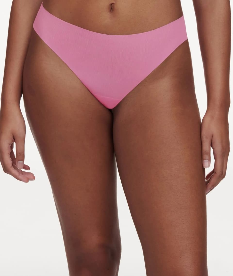 Person wearing pink seamless underwear against a white background.