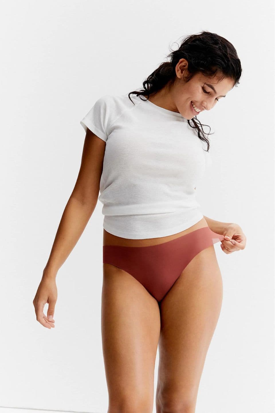 A woman is shown wearing a seamless brief.